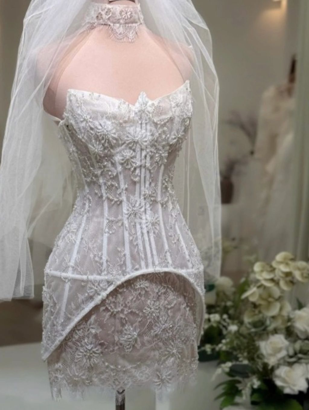 Veiled lace corset wedding gown detail
