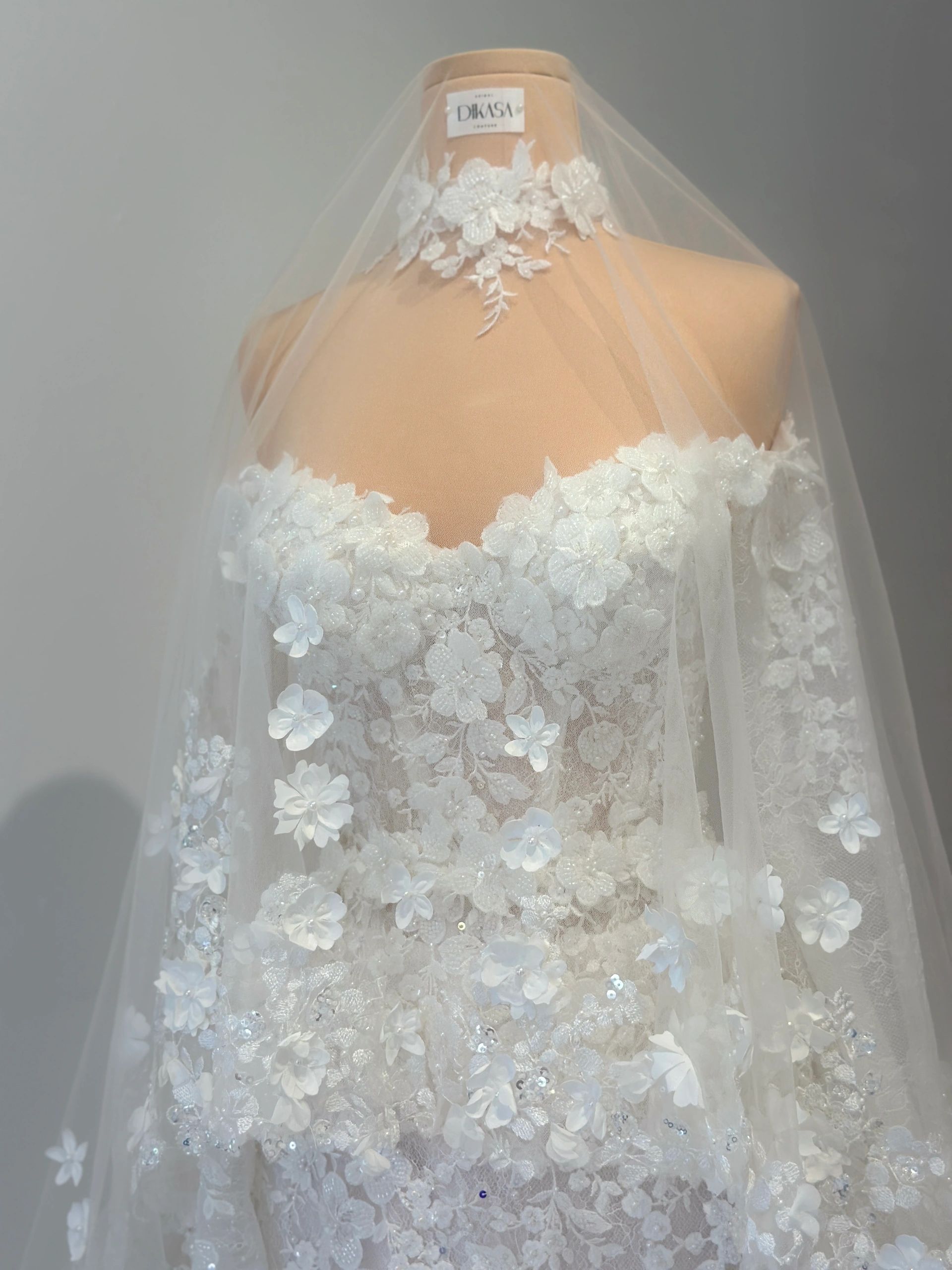 Floral wedding gown on mannequin