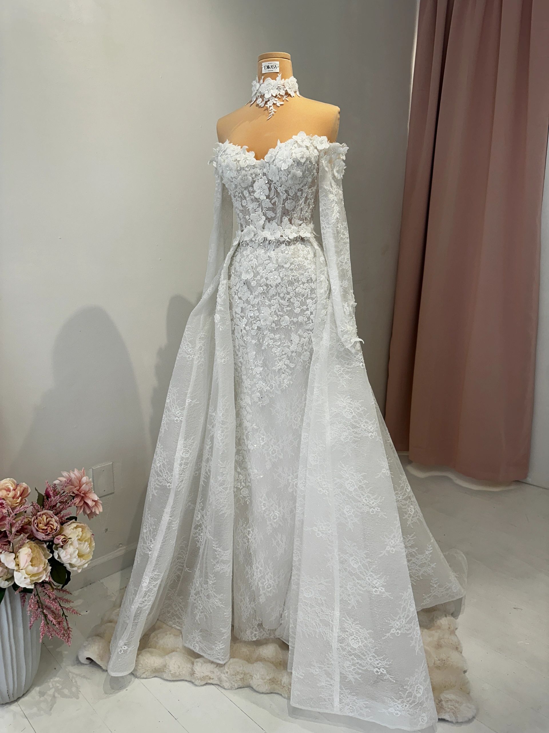 Full lace wedding gown on mannequin